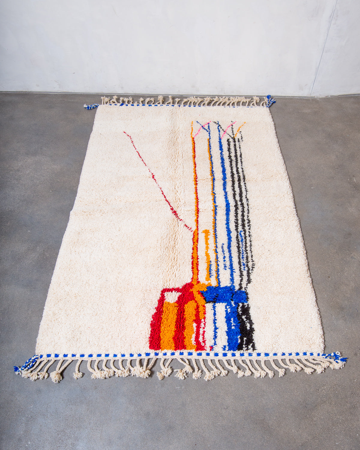Modern, designer, handcrafted Berber rug from Morocco. Beniourain carpet with beautiful colours and patterns and fluffy wool texture.